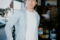 Man in casual clothing standing near a garage door.